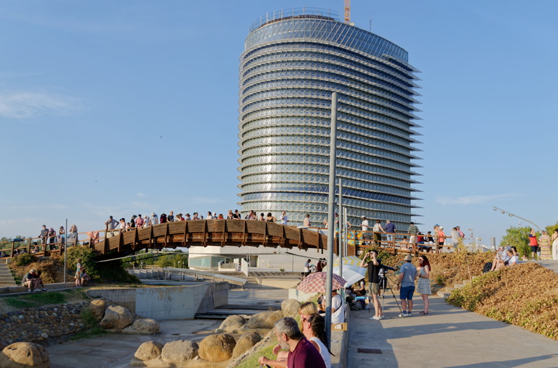18 - The iconic Torre del Agua (Water Tower) and a wooden pedestrian bridge over the dry whitewater channel in the Parque del Agua in Zaragoza, Spain